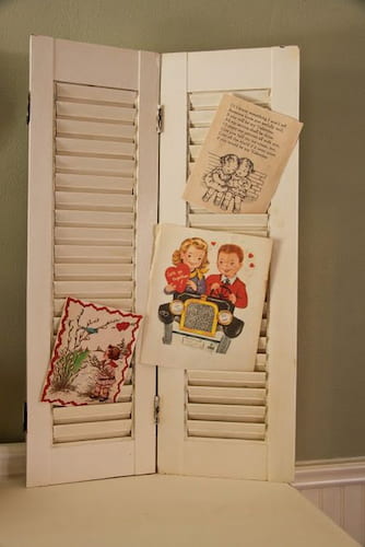 A decorative way of displaying cards. A white shutter showcasing all the special sentiments.