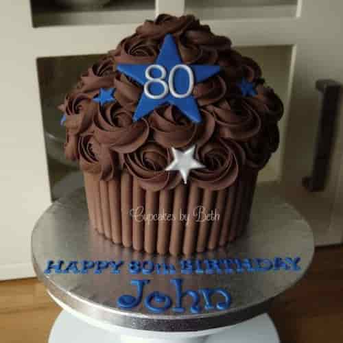 Happy 80th Birthday:  Celebrate with a sweet treat. A delicious chocolate 80th birthday cupcake.