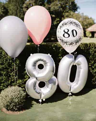Ideas for 80th Birthday Parties: Happy Birthday Balloons Creative ideas for 80th birthday parties include themed balloons placed in strategic places.