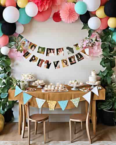 80th Birthday Party Ideas: Inspire Guests With Multiple Garlands 80th birthday party ideas featuring a balloon arch, festive garlands, and sweet treats.