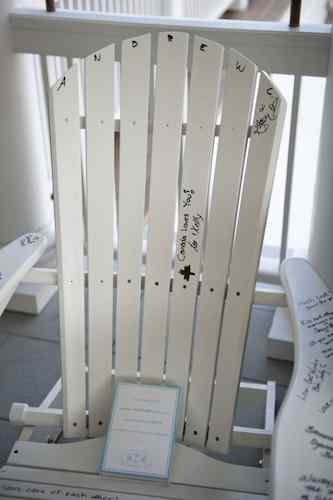 Relax and enjoy the party. White Adirondack Chair used for a Guest Book.
