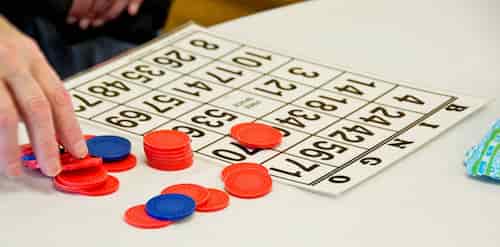 Bingo player with a card.