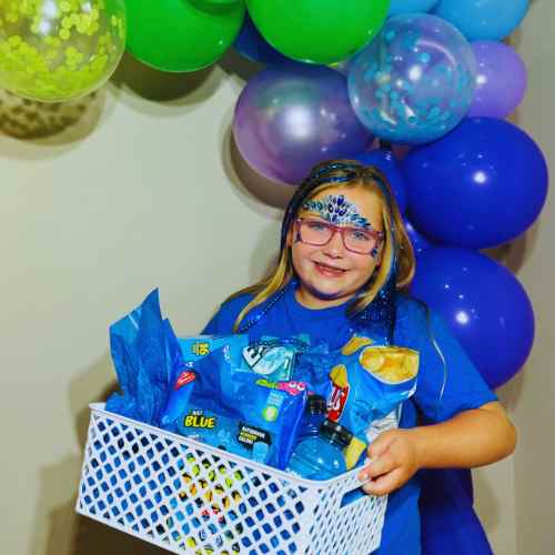 Color Party Basket Ideas Blue: Look For Snacks In A Blue Wrapper A blue themed color party basket filled with creative and fun snacks.