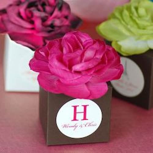Include a Variety of Thoughtful Gifts and Treats in Beautiful Bridal Shower Favor Boxes. Bridal Shower Favor Boxes Topped with Vibrantly Colored Flowers.