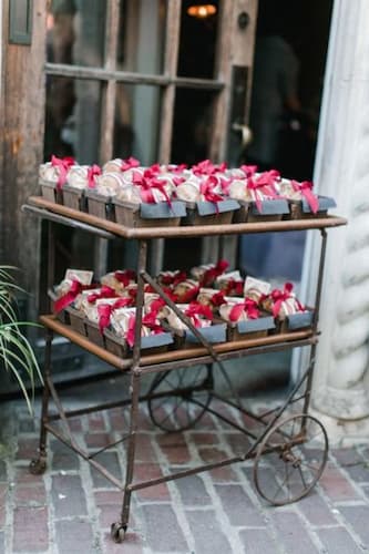 Set Up a Designated Area Where Guests Can Easily Find and Take Their Favors. Bridal Shower Rustic Favor Display.