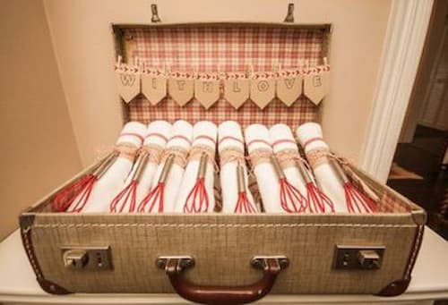 Offer Guests Kitchen Items as Party Favors for Bridal Shower. Whisk Bridal Shower Favors and Dish Towel Presented With Love in a Vintage Suitcase.