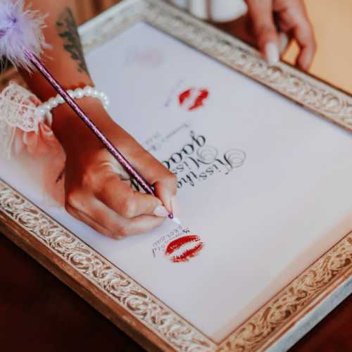 Pucker up and Kiss the Miss Goodbye. Kiss The Miss Goodbye Game: Guests leave their autograph and lip prints on a memorable frame.