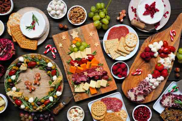 Creative Ideas for Christmas Themed Charcuterie Boards Colorful Christmas themed charcuterie boards with seasonal cheeses, meats, and fruits.