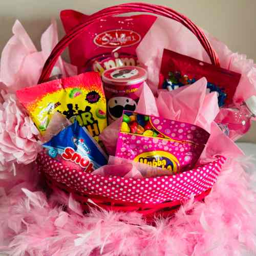 Pink Color Party Basket Ideas: Snacks In A Pink State of Mind A large pink basket filled with pink snacks for Color Party.