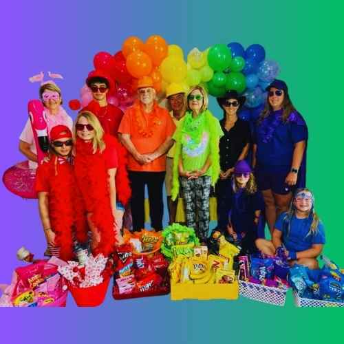 Color Party Guests in Bright, Festive Attire: Let's Party Guests at a Color Party vibrantly dressed with color coordinated snacks.