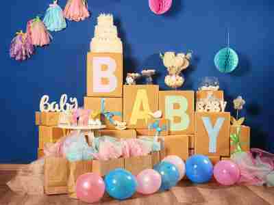 Discover the secret to decorating for a baby shower:  It's easier than you may think. Balloons, baby block boxes, and other baby shower decorations.