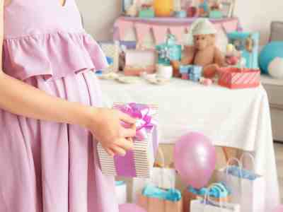 Shower the mom-to-be with gifts.  Find the best gifts for the new baby. Baby Shower Gift Table