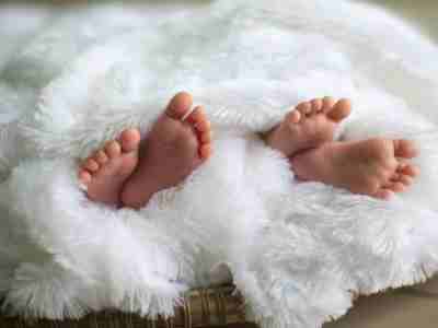 It's Twins!  Check out these ideas to celebrate. Baby Twins feet wrapped in a Blanket