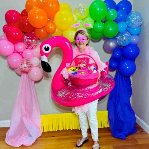 Color Party Pink: Make Your Accessories The Star Of The Show A pink Color Party guest dressed in pink accessorized with a flamingo headpiece and flamingo float.
