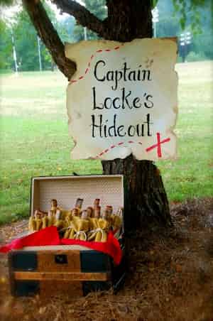 Celebrate with fun pirate birthday favors. Captain Locke's chest full of favors for a pirate birthday party.