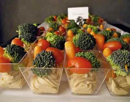 Serve appetizer cups of colorful vegetables with your party foods.