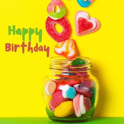 Say Happy Birthday With Candy A clear jar filled with birthday candy salad.