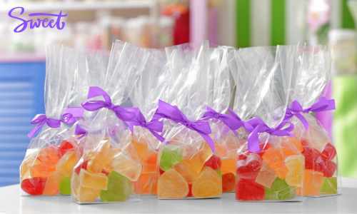 Treat Guests With Delightful Favors Individual party favors filled with candy and tied with ribbon.