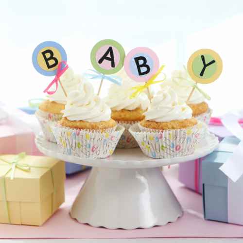 Celebrate baby showers with tasty cupcakes spelling out the reason for the excitement.