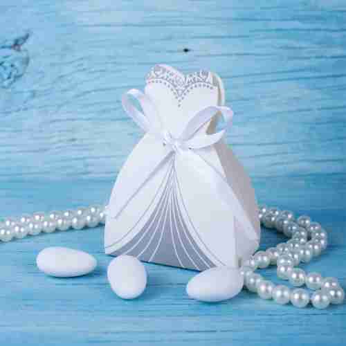 Wedding gown shaped box containing candy wedding favors.